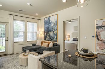 a living room with a couch and a table